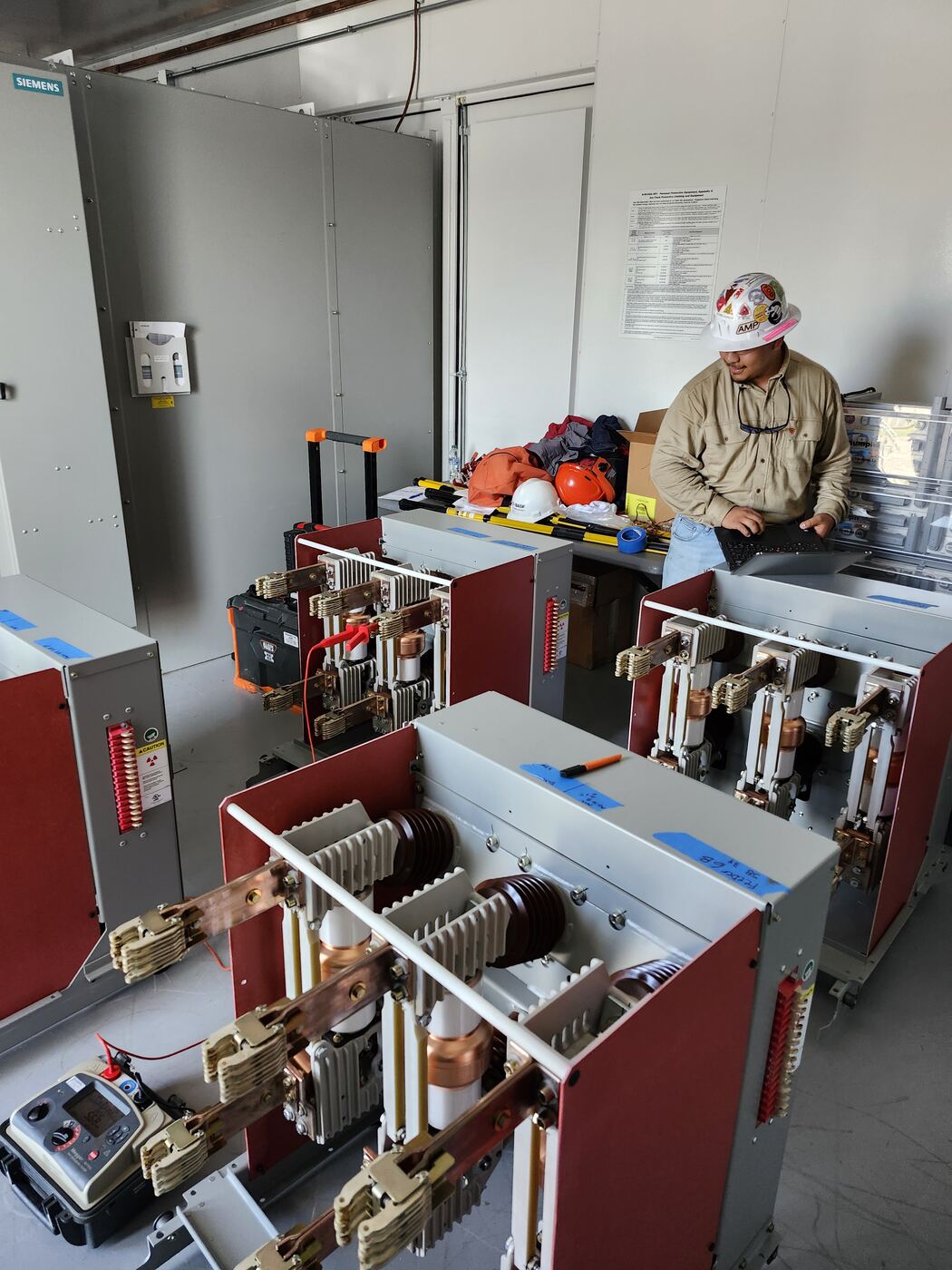 Medium-voltage drawout breakers pulled from their cubicles for testing